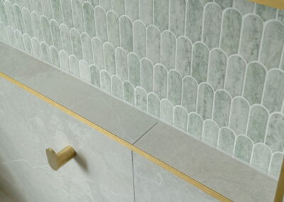 bathroom shower tiling with gold features
