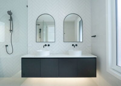 floating vanity with undercabinet lighting in Parkinson