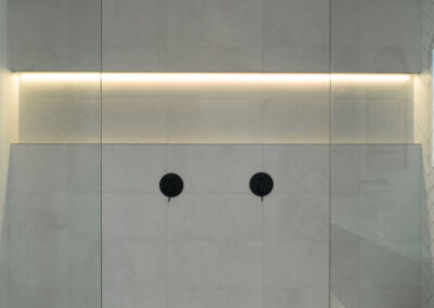 shower area niche with led lighting strips in bathroom renovation
