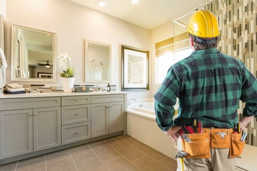 contractor in a finished bathroom