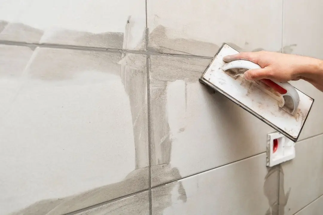 grouting bathroom tiles
